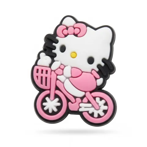Jibbitz Hello Kitty sur un vélo rose avec panier, robe rose et nœud rose