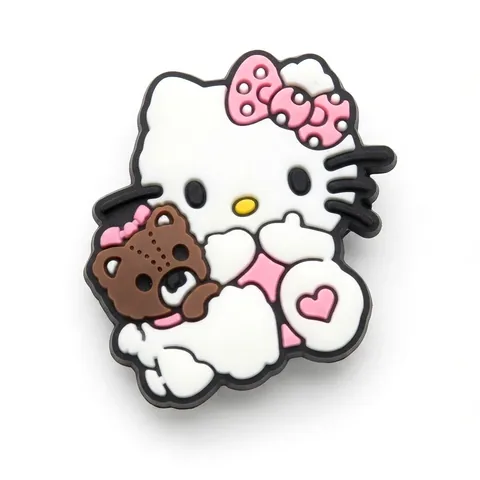 Jibbitz Hello Kitty serrant un nounours marron, nœud rose à pois et cœur rose au pied
