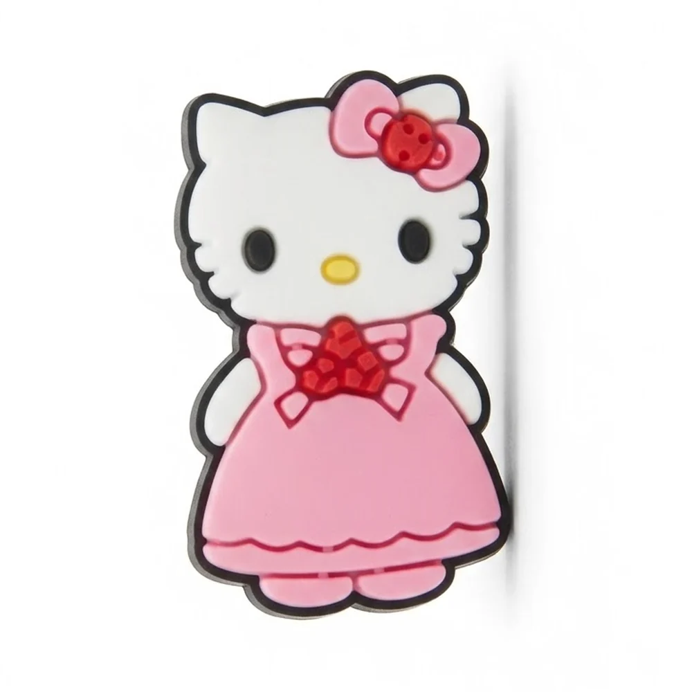Jibbitz Hello Kitty en longue robe rose évasée, gros nœud rouge au col