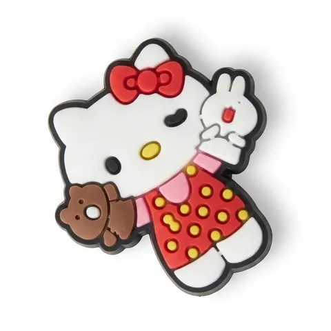 Jibbitz Hello Kitty qui fait coucou, robe rouge à pois jaunes et ourson marron