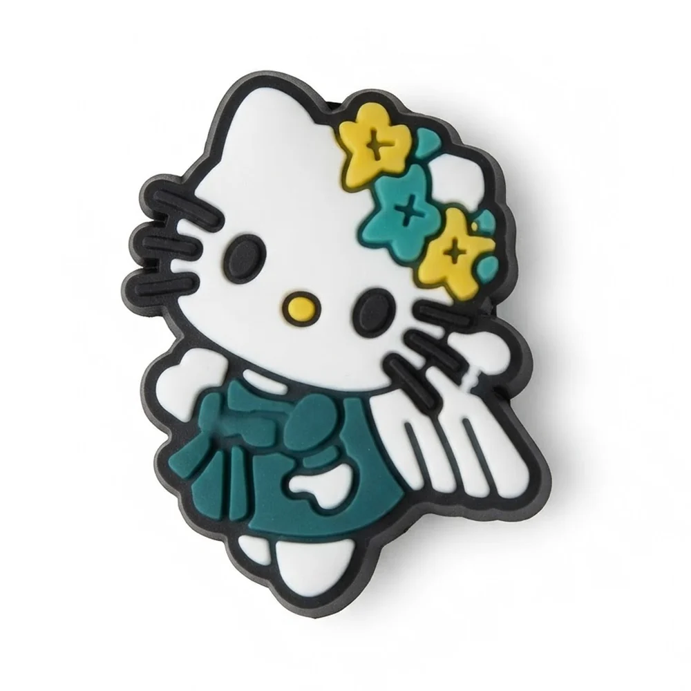 Jibbitz Hello Kitty en robe bleu canard à cœur blanc, fleurs bleues et jaunes sur l'oreille
